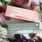 Two boxes of 'Sow the Magic' bath bombs with floral background