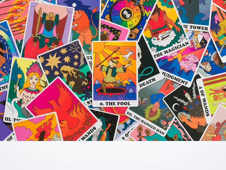 Collage of colorful tarot cards with various symbols and text.