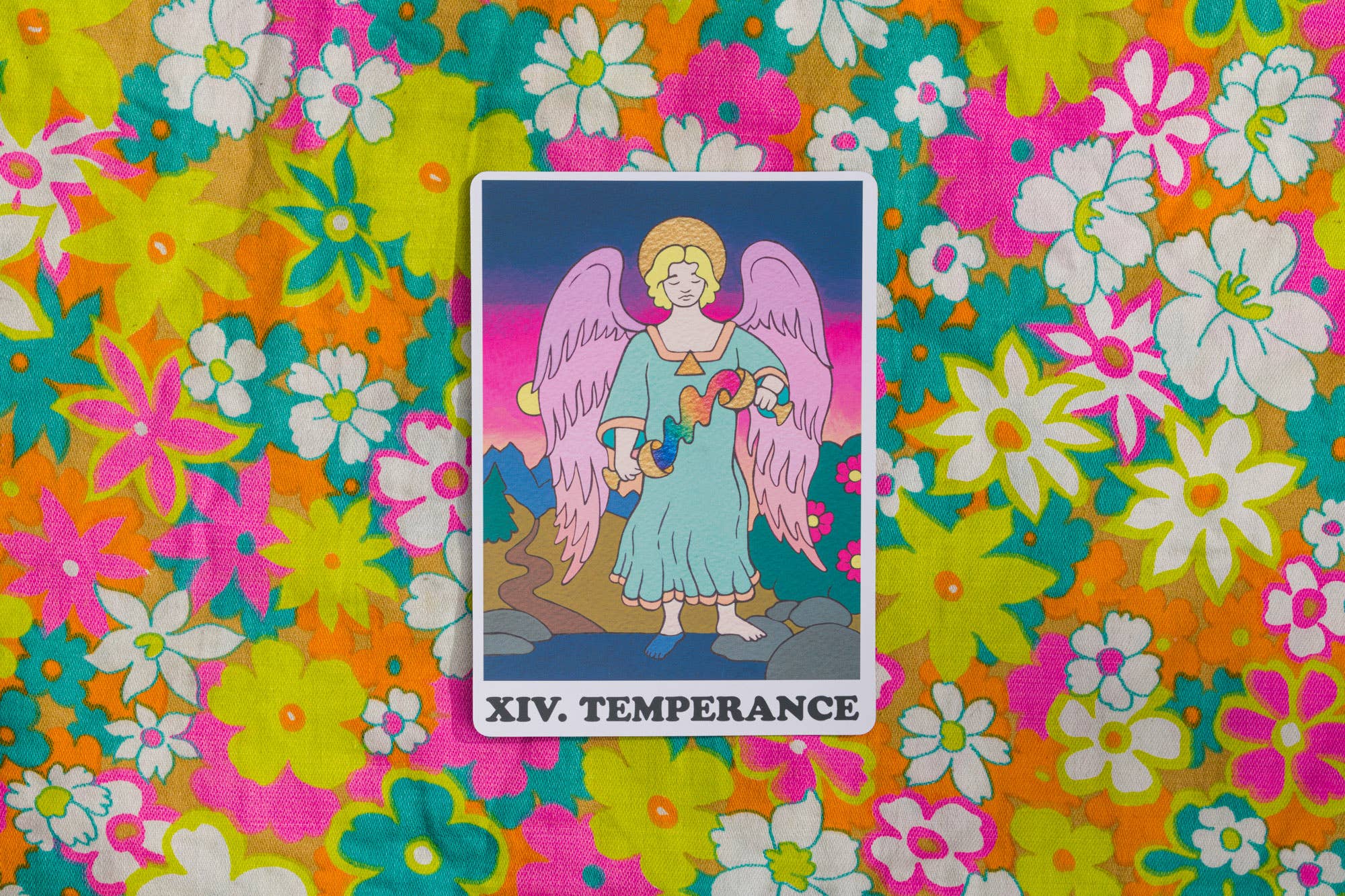 Tarot card titled 'XIV. Temperance' on a colorful floral background