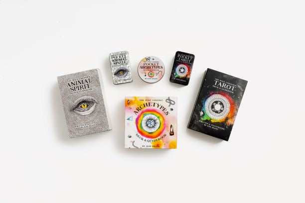 Collection of tarot card decks on a white background