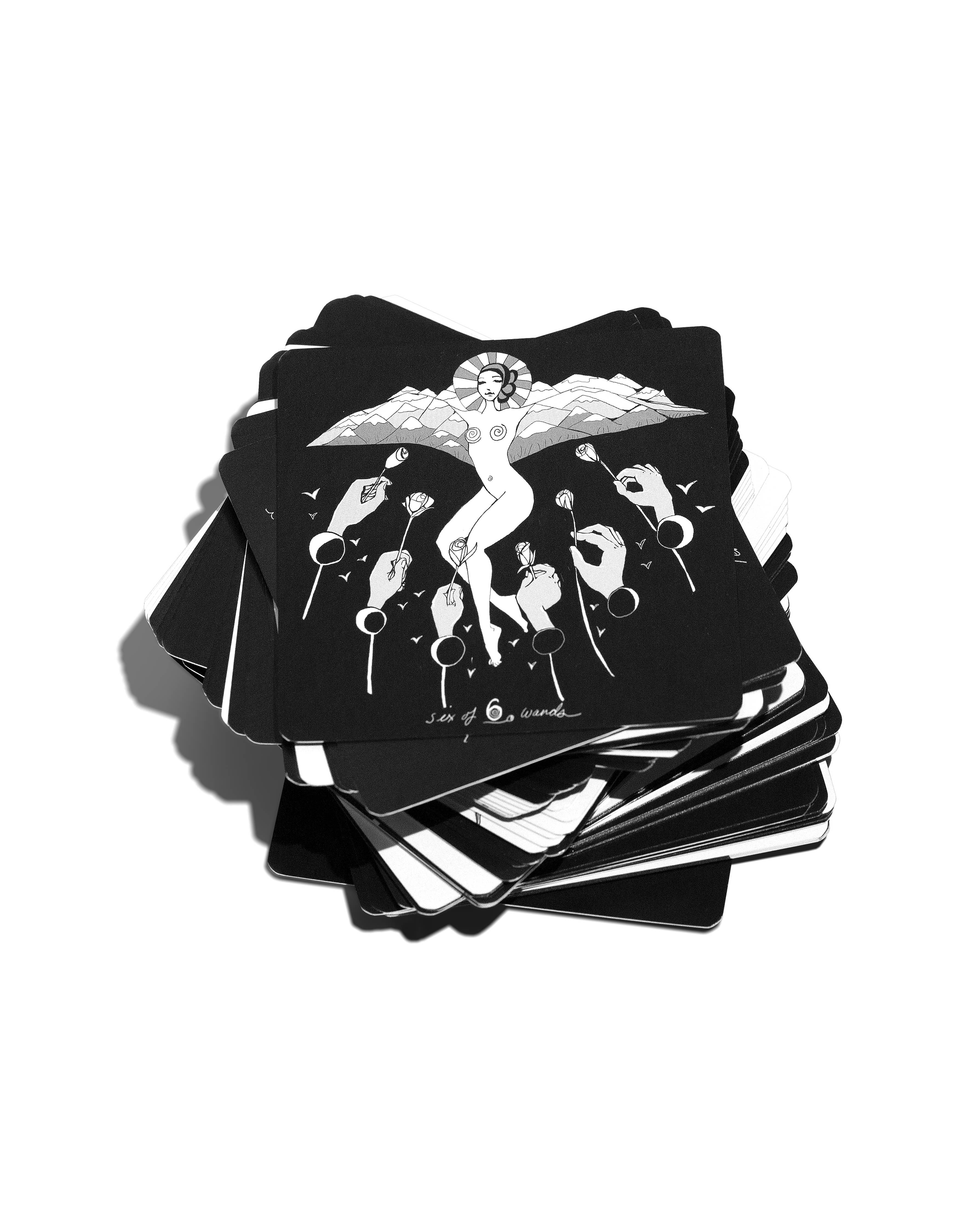 Stack of black tarot cards with white illustrations on a white background