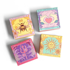 Four colorful boxes with astrological designs on a white background