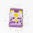 Purple packaging of a salt soak product with sun and moon design on a white background