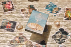 Book titled 'The Seashell of Love' on a surface with shell patterns