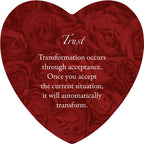 Heart-shaped arrangement of red roses with a motivational quote on a white background