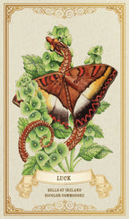 Decorative card with a butterfly and green leaves, featuring the word 'Luck' and branding text.
