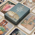 Seafolk Oracle card game box surrounded by tarot-style cards on a wooden surface.