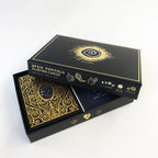 Open Ports Cards playing cards box and deck on a clean white background. The packaging is black with gold detailing, and the deck of cards is shown inside the open box.