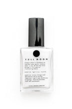 A clear glass bottle of LOVE BY LUNA Full Moon nail polish with a black cap, shown on a clean white background.