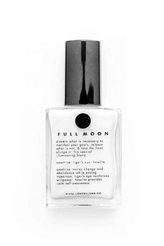 A clear glass bottle of LOVE BY LUNA Full Moon nail polish with a black cap, shown on a clean white background.