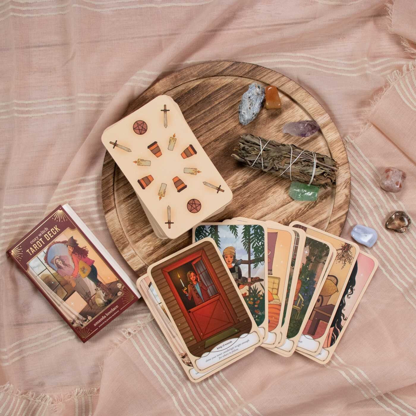 Wooden tarot card set with cards, box, and crystals on a textured surface