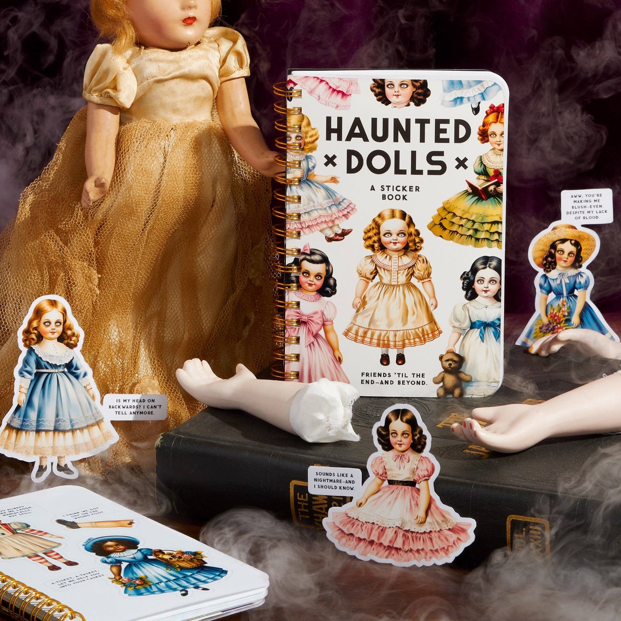 Sticker book titled 'Haunted Dolls' with dolls and stickers on a dark background