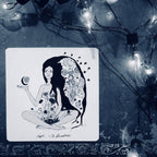 Illustration of a woman with floral designs on her hair and body, surrounded by string lights.