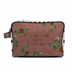 Cosmetic bag with floral design and text on a white background