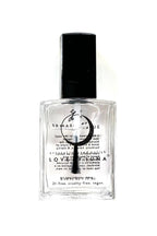Perfume bottle with a black cap and clear body on a white background