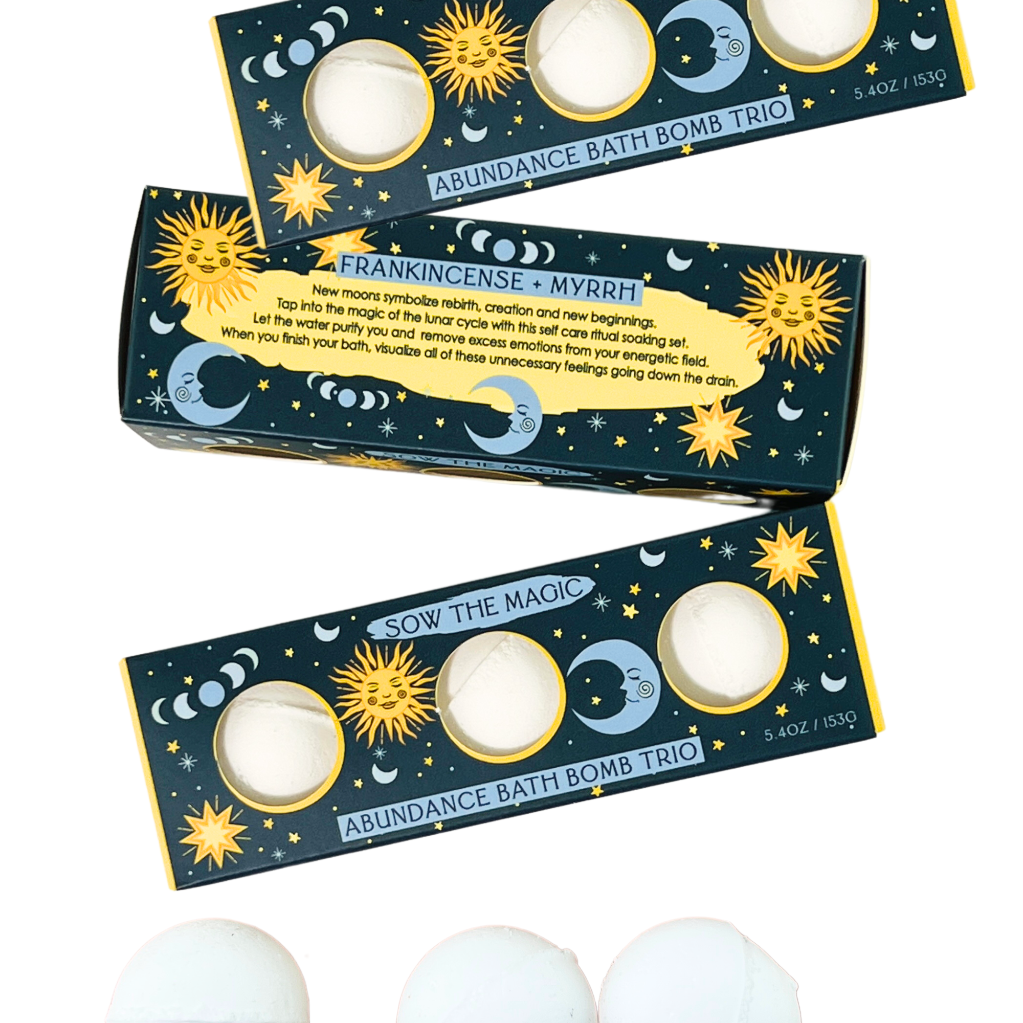 Three boxes of Abundance Bath Bomb Trio with celestial designs on a white background