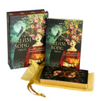 Dream Song Oracle book with colorful cover and gold ribbon on a white background