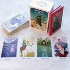 White Numinen tarot cards with a box and four card illustrations on a white surface.