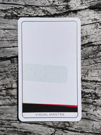 Card with 'Visual Mantra' branding on a wooden surface