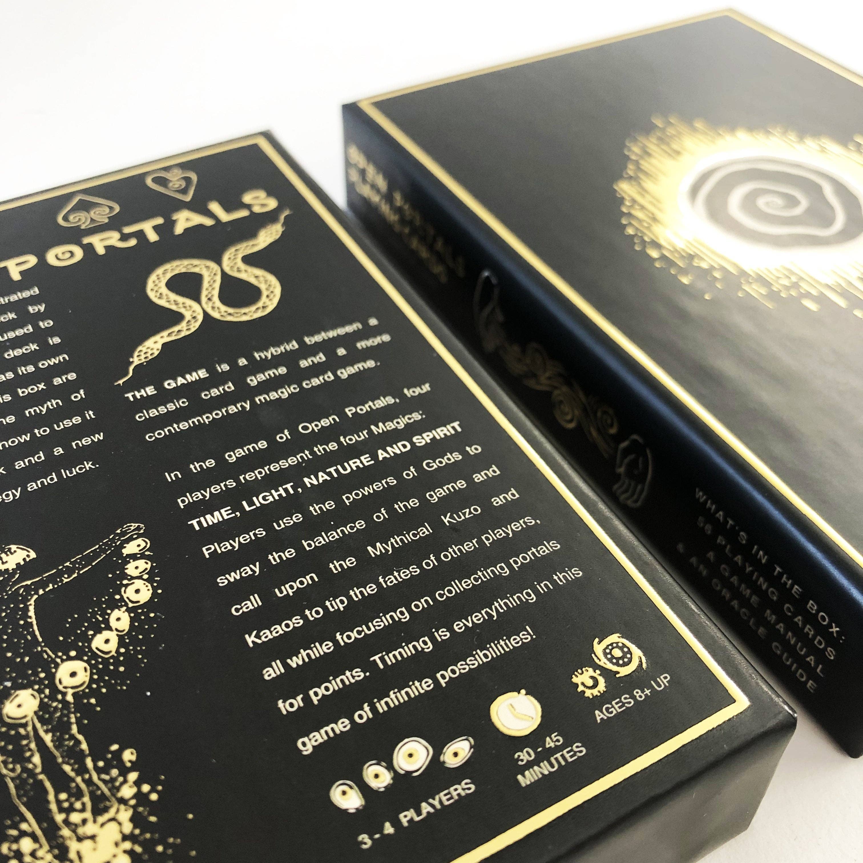 Two black game boxes with gold foil detailing, shown at an angle on a white background. The front box displays the title 'PORTALS' and game description text, while the side box shows a glowing spiral emblem.