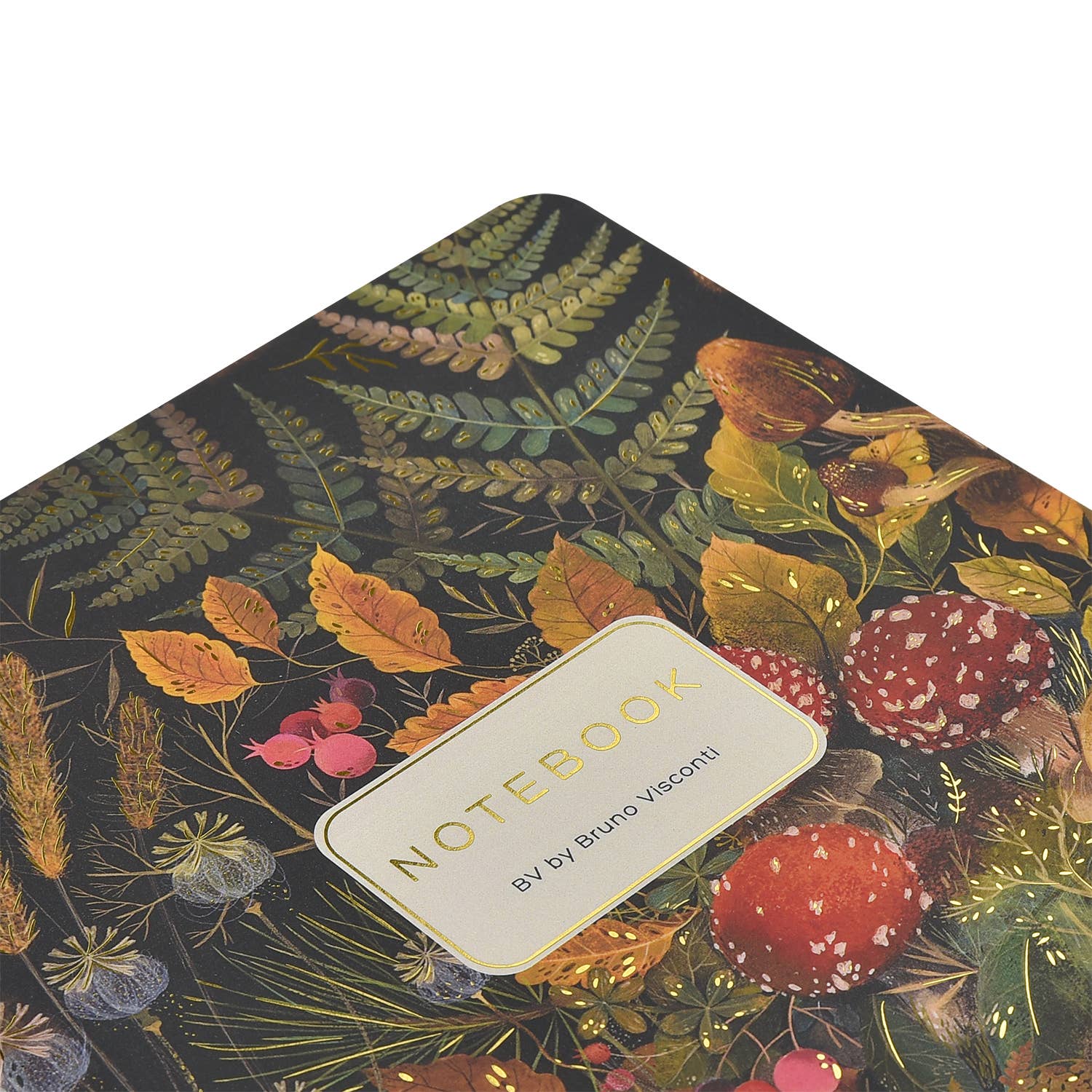 Notebook with a botanical design featuring leaves and mushrooms on a dark background.