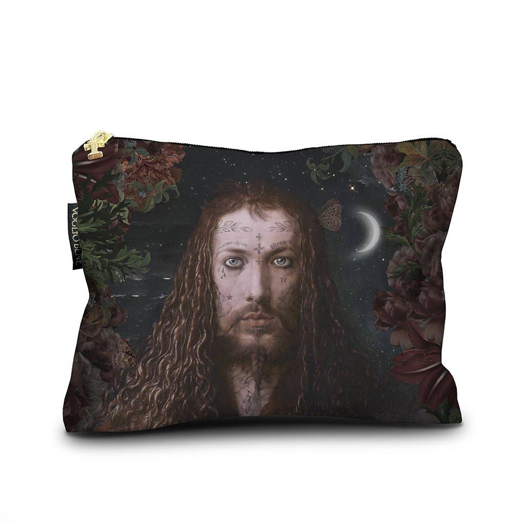 A rectangular zip pouch featuring a dark fantasy-style print of a man's face with long hair, surrounded by flowers and a crescent moon under a starry sky. The pouch has a gold zipper and a small black fabric tag on the left side.