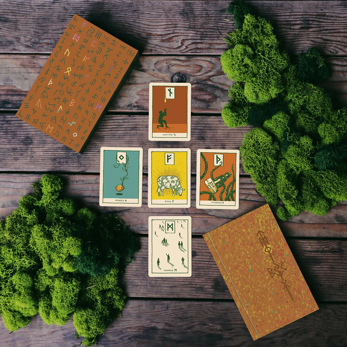 Set of tarot cards on a wooden surface with green foliage
