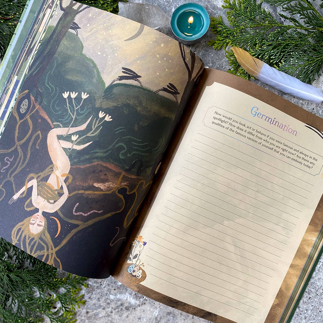 Open book with artistic cover featuring a woman and plants, next to a lined notebook page.