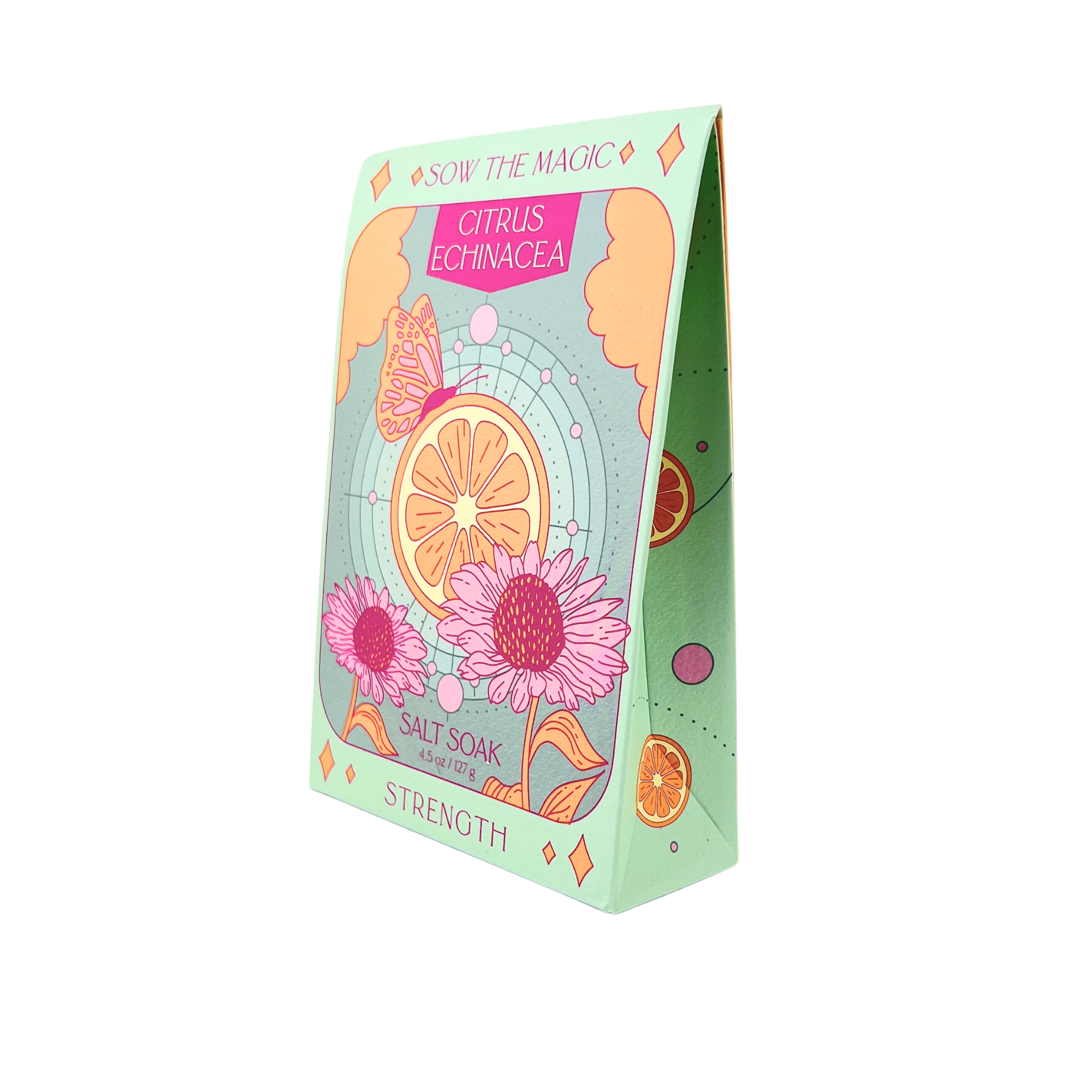 Packaged salt soaks with floral and citrus design on a white background