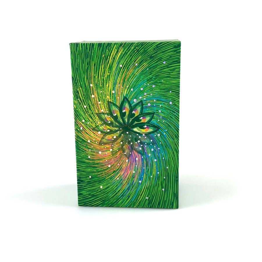 Notebook with a colorful design of a lotus flower on a green background