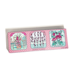 Pack of shower steamers with colorful labels on a white background