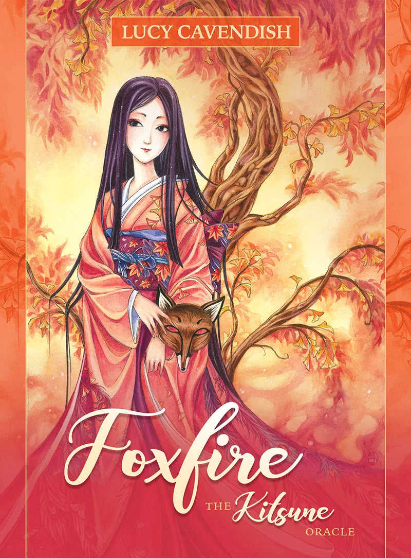 Front cover of the oracle card deck 'Foxfire: The Kitsune Oracle' by Lucy Cavendish, featuring an illustration of a woman in a pink kimono holding a fox against a warm orange and yellow autumn background.