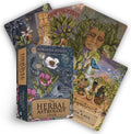 Three card decks from Adriana Ayales' Herbal Astrology Oracle on a white background