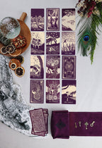 Set of tarot cards with decorative elements on a white surface