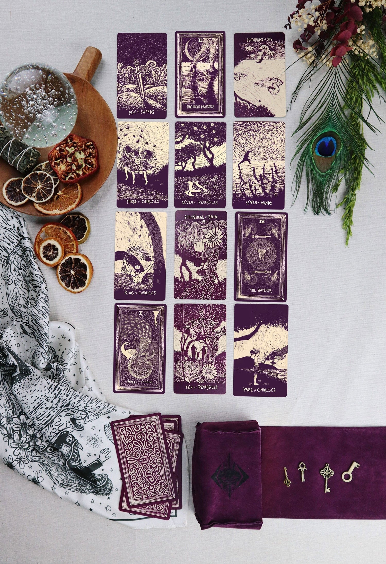 Set of tarot cards with decorative elements on a white surface