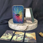 Colorful tarot card with starburst design on a marble stand, surrounded by tarot cards and a crystal.