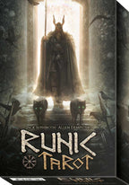 Cover of 'Runic Tarot' with a figure in a hooded cloak and horns standing in a doorway.