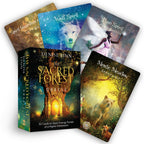 Set of oracle cards with colorful designs and a book titled 'The Sacred Forest Oracle' by Denise Linn.