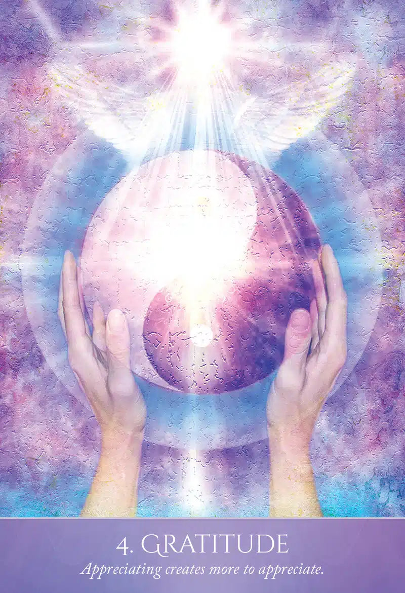 Two hands holding a glowing pink crystal ball against a purple and blue gradient background with the word 'Gratitude' at the bottom.