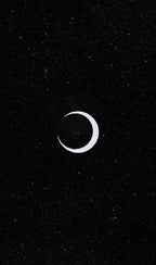 Crescent moon symbol on a black background